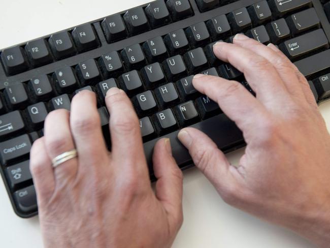 (FILES) In this file photo taken on November 21, 2016 a man types on a computer keyboard in this photo illustration taken in Washington, DC. - An elite group of North Korean hackers has been identified as the source of a wave of cyberattacks on global banks that has netted "hundreds of millions" of dollars, security researchers said on October 3, 2018. A report by the cybersecurity firm FireEye said the newly identified group dubbed APT38 is distinct from but linked to other North Korean hacking operations, and has the mission of raising funds for the isolated Pyongyang regime. (Photo by SAUL LOEB / AFP)