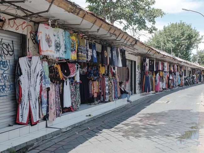 Clothes and souvenir shops in Poppies street in Kuta, Bali.