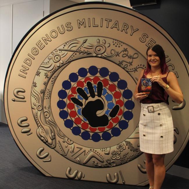 Drawing inspiration from Ms Sutton’s painting the colourful $2 coin features a black handprint in the centre and is surrounded by three rows of dots in the defence force’s tri-service flag colours.