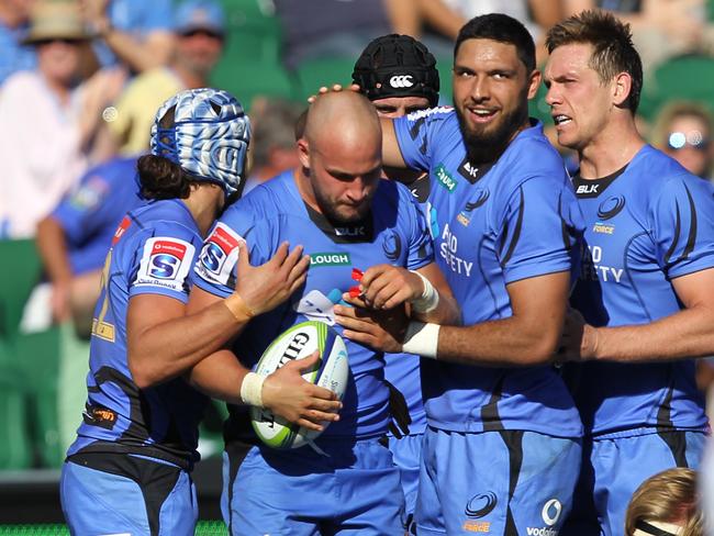 **FILE** A Sunday, April 9, 2017 image reissued Monday, April 10, 2017 of Force celebrate during the Round 7 Super Rugby match between the Western Force and the Southern Kings at NIB Stadium in Perth. The Western Force and Melbourne Rebels will learn within three days which of them is to be axed, Australian Rugby Union chairman Cameron Clyne says. It's part of a broader restructure of an unwieldy and unpopular Super Rugby competition format, which is to be slashed from 18 teams to 15 after this season, with two South African sides also to go. (AAP Image/Richard Wainwright) NO ARCHIVING, EDITORIAL USE ONLY