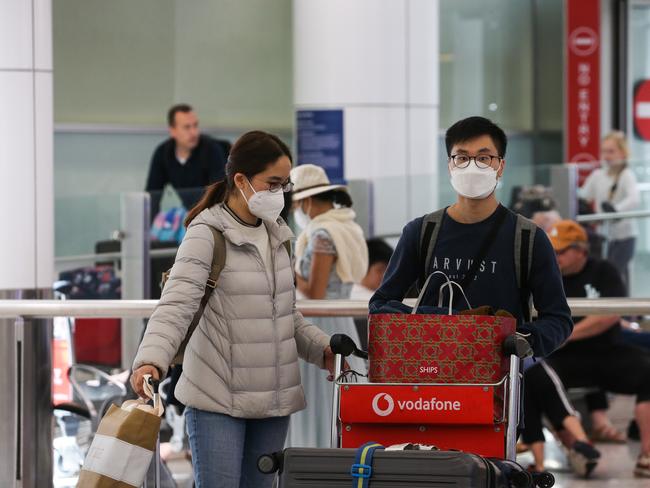 SYDNEY, AUSTRALIA - Newswire Photos JANUARY 02, 2022: People are seen arriving at the Sydney International Airport arrivals terminal, off a Cathay Pacific flight from Hong Kong after Australia set new Covid entry rules for travellers entering the country from China. The government is reportedly considering testing plane waste water on affected flights also. Picture: NCA Newswire / Gaye Gerard