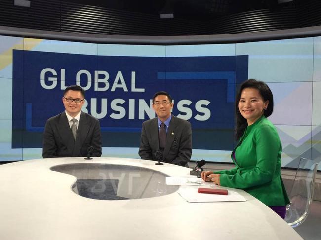 Ambush in the boardroom … Cheng Lei, pictured with colleagues at China Central TV, thought she was going to a meeting about a new show. Instead she was arrested.