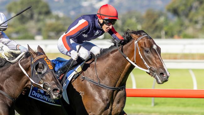 Jason Holder aboard Air Assault staves off Warmonger in the Port Adelaide Guineas. Picture: Makoto Kaneko