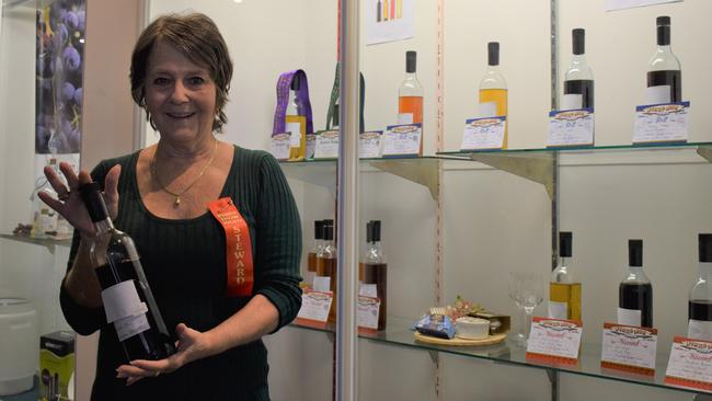 Val Lloyd, Ipswich, and Alan Brown, Bellbird Park, at the Ipswich Show after winning awards for their respective bottles of wine. Picture: Ebony Graveur