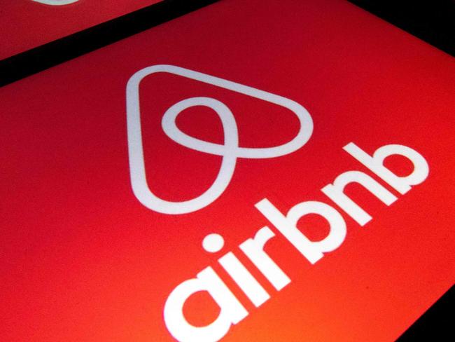 (FILES) In this file illustration picture taken on November 22, 2019, shows the logo of the online lodging service Airbnb displayed on a tablet in Paris. - Airbnb said August 2, 2022 revenue in the recently ended quarter topped $2 billion as people shook off pandemic worries and took part in a banner travel season. (Photo by Lionel BONAVENTURE / AFP)