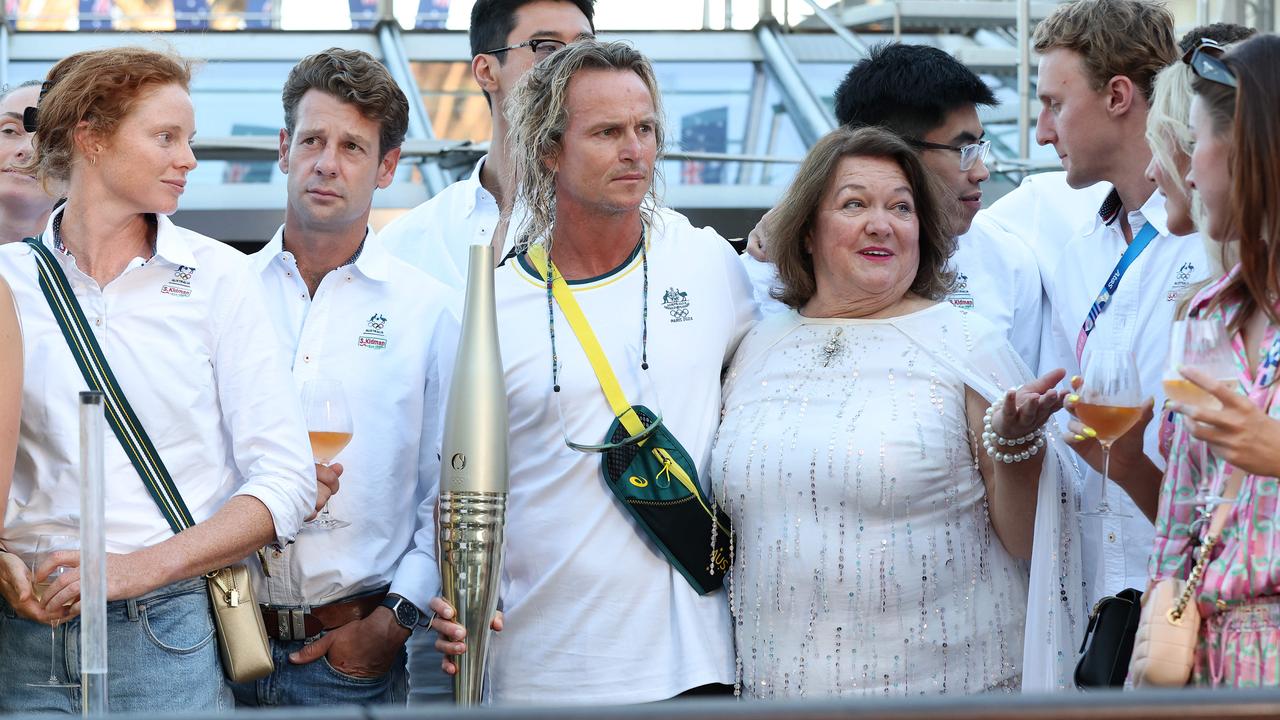 Gina Rinehart on the Paris cruise with swimming coach Dean Boxall, left, and Australian Olympic athletes. Picture: Adam Head