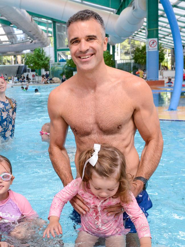 Peter Malinauskas with his daughter Eliza at the Adelaide Aquatic Centre in North Adelaide where he announced plans to redevelop the site if Labor wins the March election. Picture: Brenton Edwards