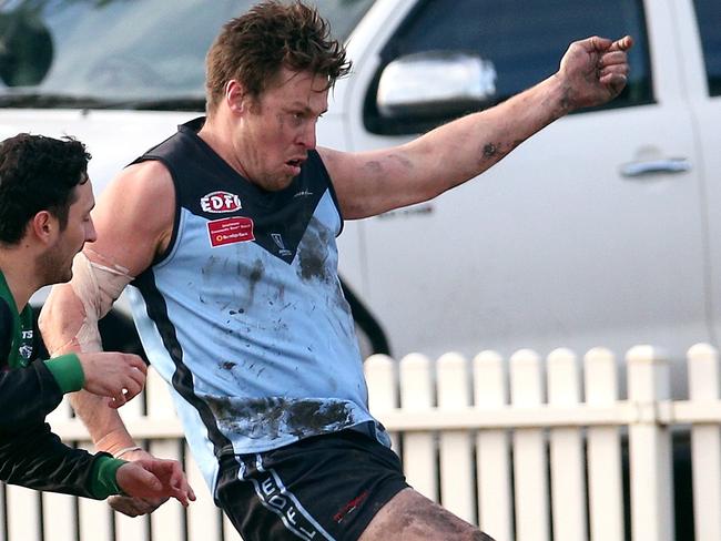 EDFL footy: Aberfeldie v Greenvale: Nicholas Meese of Aberfeldie kicks under pressure from Daniel Micevski of GreenvaleSaturday, July 3, 2021, in Aberfeldie, Victoria, Australia. Picture: Hamish Blair