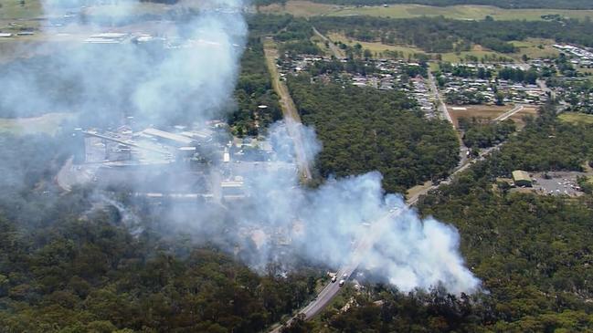 A video grab showing smoke billowing from the bushland in Appin after the crash. Picture: 9 News