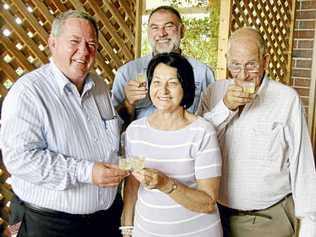 Primary Industries Minister Tim Mulherin toasts the health of the wine industry in the region with Isis Winery proprietors June and Bill Brown and Hill of Promise proprietor Terry Byrne (back). He also launched the Childers Wine Experience map. Picture: Gary Hutchison