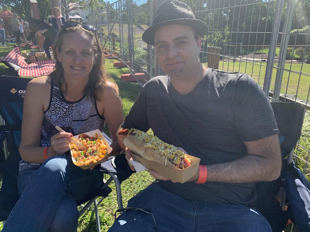 Lucinda Briscoe and Chad Daily from Maryborough enjoy loaded brisket fries and a foot long cabana at Relish Food and Wine Festival. Photo: Stuart Fast