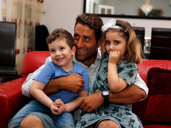 Noah (L) and Lahela al-Amine with their father Ali Zeid al-Amine (aka Ali Elamine) in their family home in Beirut. Picture: REUTERS/Mohamed Azakir