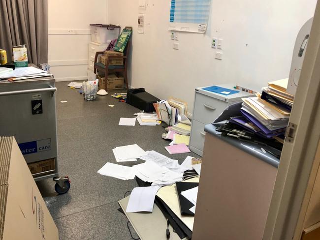 Records left scattered across rooms in the abandoned facility.