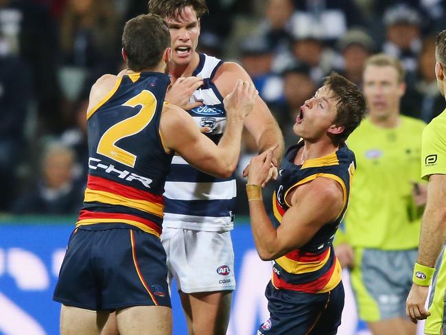 Matt and Brad Crouch wrestle with Geelong’s Tom Hawkins during Round 10. Picture: Michael Dodge/Getty