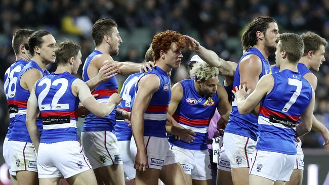 Western Bulldogs get around Ed Richards, middle, after one of his three goals against Port Adelaide at Adelaide Oval. Picture SARAH REED