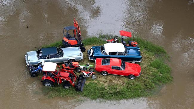 Vehicles on dry land as the Logan River bursts its banks in 2022. PHOTO: Adam Head