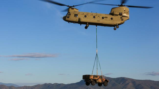 A Hawkei armoured vehicle was being winched by a CH-47 Chinook helicopter at RAAF Base Townsville, when pilots were forced to drop it on November 4, 2019.