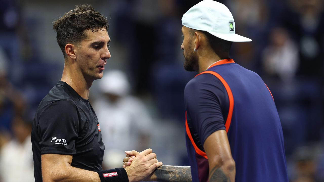 Nick Kyrgios shakes hands with Thanasi Kokkinakis