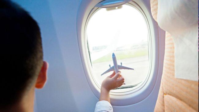 A mother wonders if she should leave her child in economy alone while she sits in business class. Picture: iStock