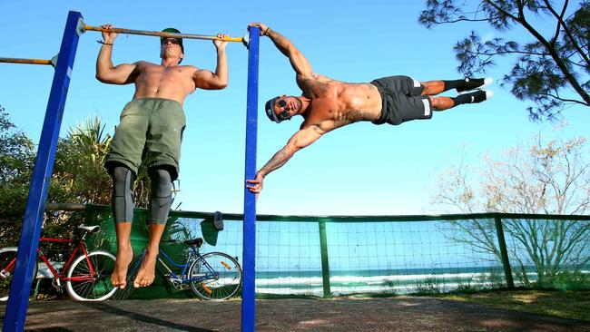 Tyson Kiernan and AMPM Fitness guru Johann Ofner use the fitness equipment at Burleigh and would love to see more of it to train on. Photo: Kit Wise