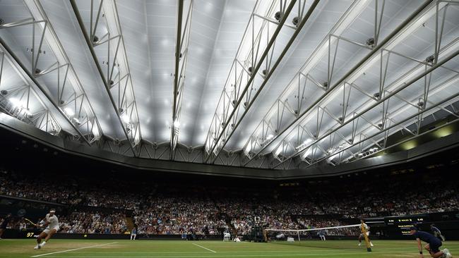 Rafael Nadal and Novak Djokovic under the roof late on Friday night, London time, in their semi-final. Picture: AFP