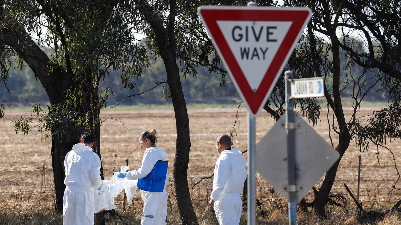 Disaster Victim Identification officers collect evidence on the corner where the horror crash unfolded. Picture: Ian Currie