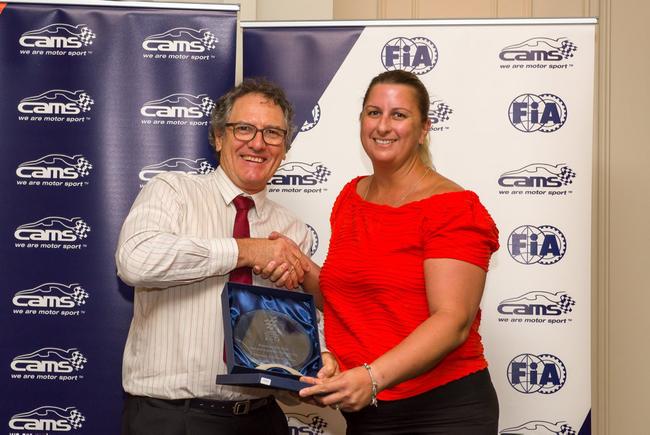 Leyburn Sprints President Tricia Chant receives the CAMS Queensland Motor Sport Event of the Year award from MG Car Club of Queensland Secretary Malcolm Spiden (Pic by Ian Welsh, Shifting Focus). Picture: Contributed