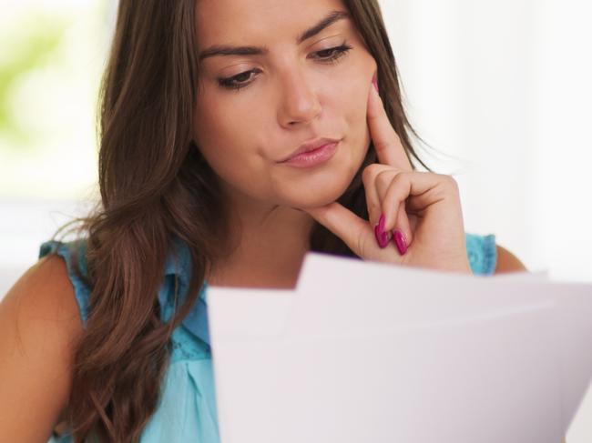 Thoughtful woman working at home