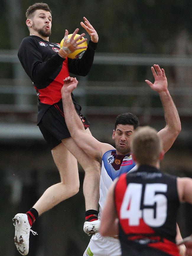 Tim Currie flies high against Banyule earlier this year. Picture: Hamish Blair