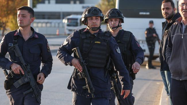 Turkish Jandarma stand guard at the entrance to the Turkish Aerospace Industries facility following the attack. Picture: Getty Images.