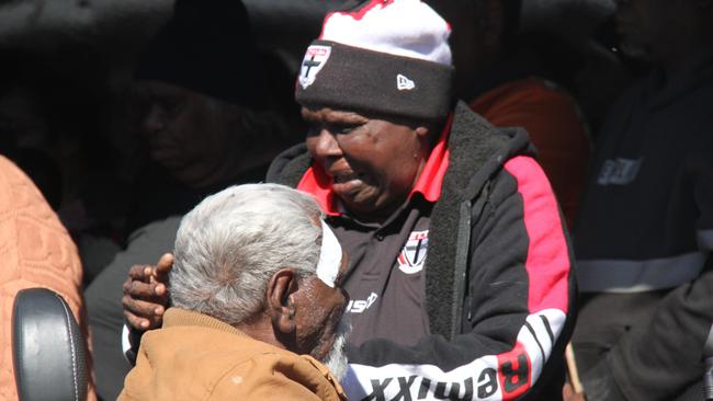 Senior Warlpiri Elder Ned Hargraves alongside family of a 24-year-old man from Yuendumu at a vigil outside Coles in Alice Springs on May 30, 2025. The young man who died in custody on May 27, 2025, was Mr Hargraves grandson. Picture: Gera Kazkov