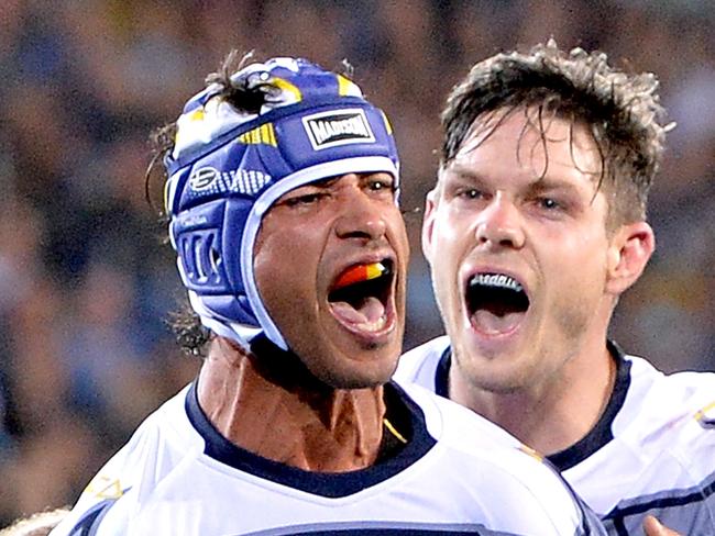 GOLD COAST, AUSTRALIA - SEPTEMBER 01: Johnathan Thurston of the Cowboys celebrates a try by team mate Gavin Cooper during the round 25 NRL match between the Gold Coast Titans and the North Queensland Cowboys at Cbus Super Stadium on September 1, 2018 in Gold Coast, Australia.  (Photo by Bradley Kanaris/Getty Images)