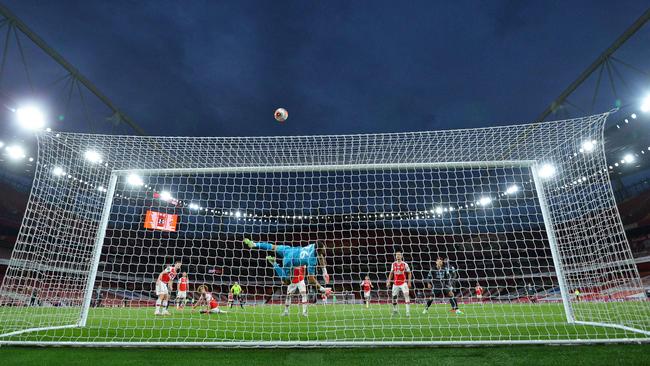 Arsenal goalkeeper Emiliano Martinez tips a shot from Liverpool's Mohamed Salah over the bar at the Emirates Stadium in London. Picture: AFP