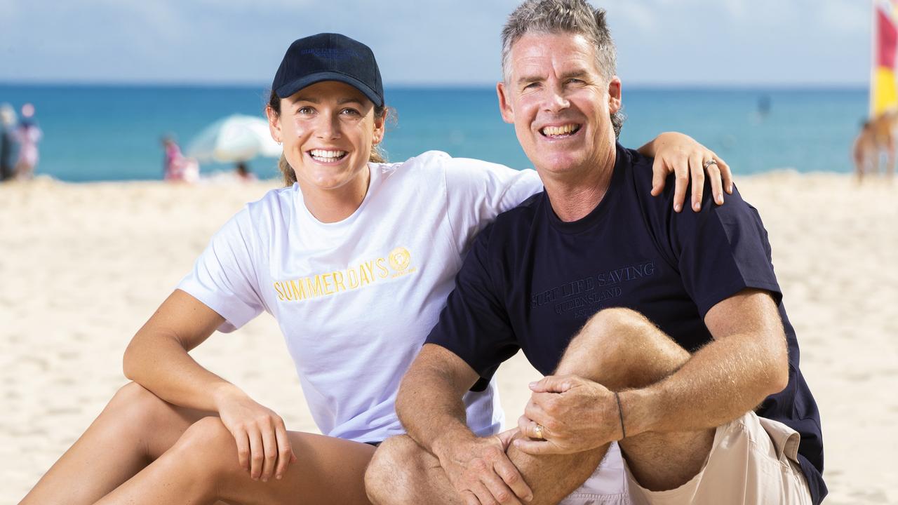 Surf Life Saving champion Jordan Mercer with dad and legend of the sport Darren Mercer on Noosa Main Beach. Picture: Lachie Millard