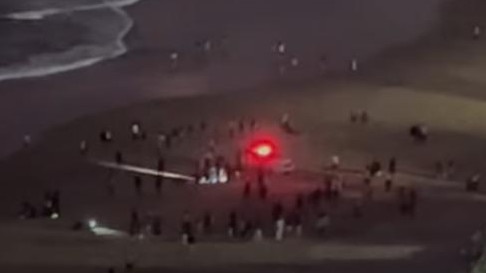 Scenes at Surfers Paradise during Wednesday night’s drowning tragedy. Picture: Lachie Harrington