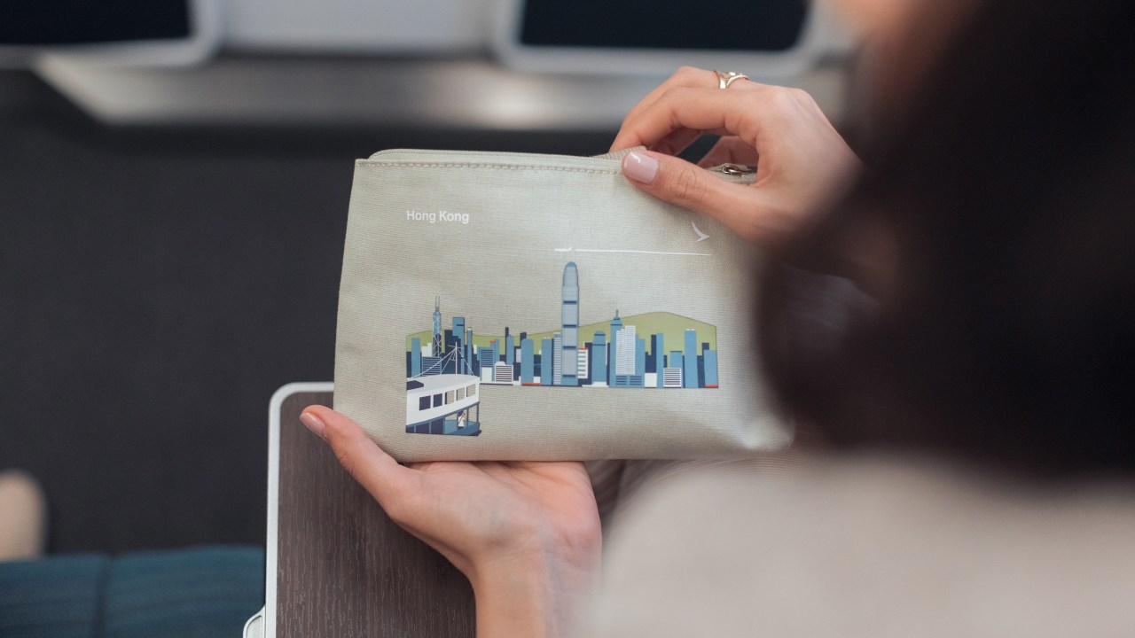 <h2>Amenity kit</h2><p>On long-haul routes you&rsquo;ll get an amenity kit featuring socks, an eyemask, earplugs, toothbrush and toothpaste.</p><p>The bag that it comes in is actually quite cute, with an artsy depiction of different Cathay destinations on it. It&rsquo;s now housing my charging cables in it for future travels.</p>