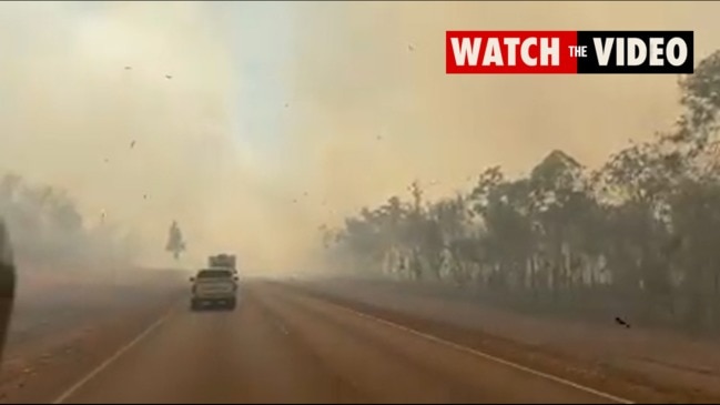 Bushfires near Batchelor shroud the road in smoke