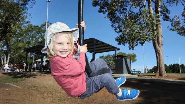 Sam Perry on the swings at Underwood Park. (AAP Image/Jono Searle)