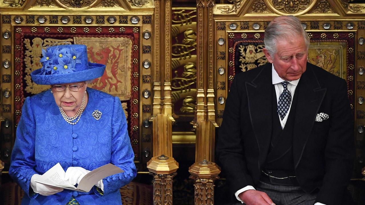 Queen Elizabeth II sits alongside her son Prince Charles during the state opening of parliament in 2017. Picture: AP