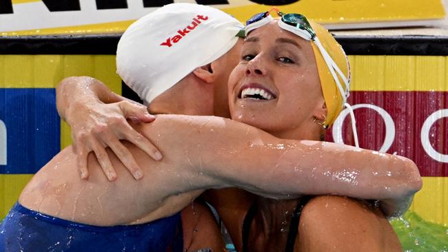 Emma McKeon celebrates winning gold with Sweden’s Michelle Coleman after the women's 50m freestyle final. Picture: AFP