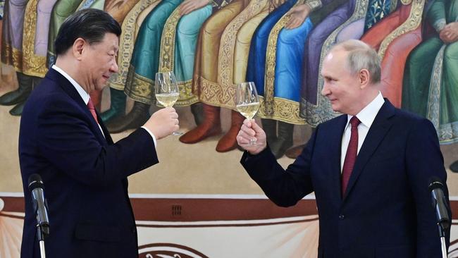 Xi Jinping and Vladimir Putin toast each other at the Kremlin in March. Picture: AFP