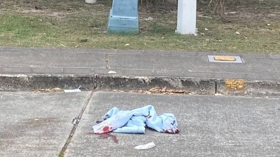 A bloody cloth at the scene of the incident in the heart of Surfers Paradise. Picture: Greg Stolz