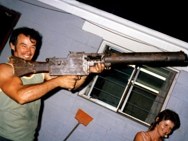 Ivan Milat holding a WW1 vintage machine gun at the home of his brother Alex in 1983.