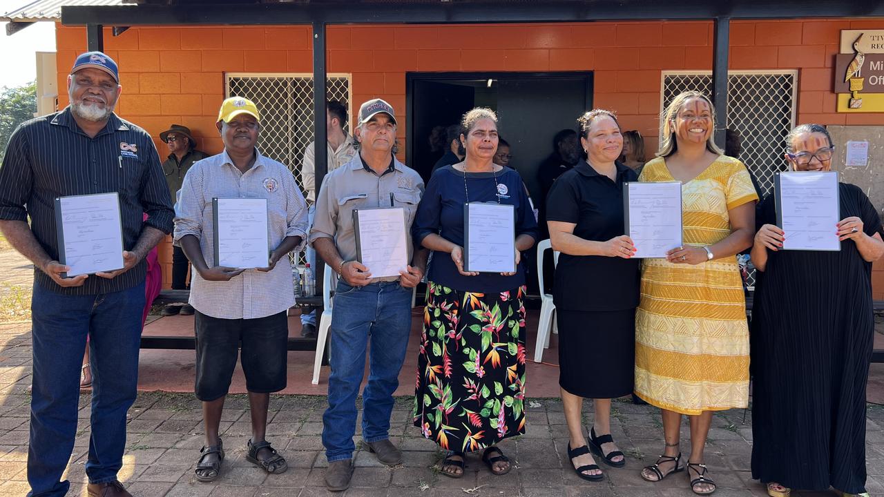 NLC chair Matthew Ryan, TLC chair Leslie Tungatalum, CLC chair Matthew Palmer, ALC chair Cherelle Wurrawilya, Aboriginal Housing NT chief executive Skye Thompson, NT Remote Housing Minister Selena Uibo and federal Minister for Indigenous Australians Linda Burney signed the $4bn agreement at Milikapiti on Thursday.