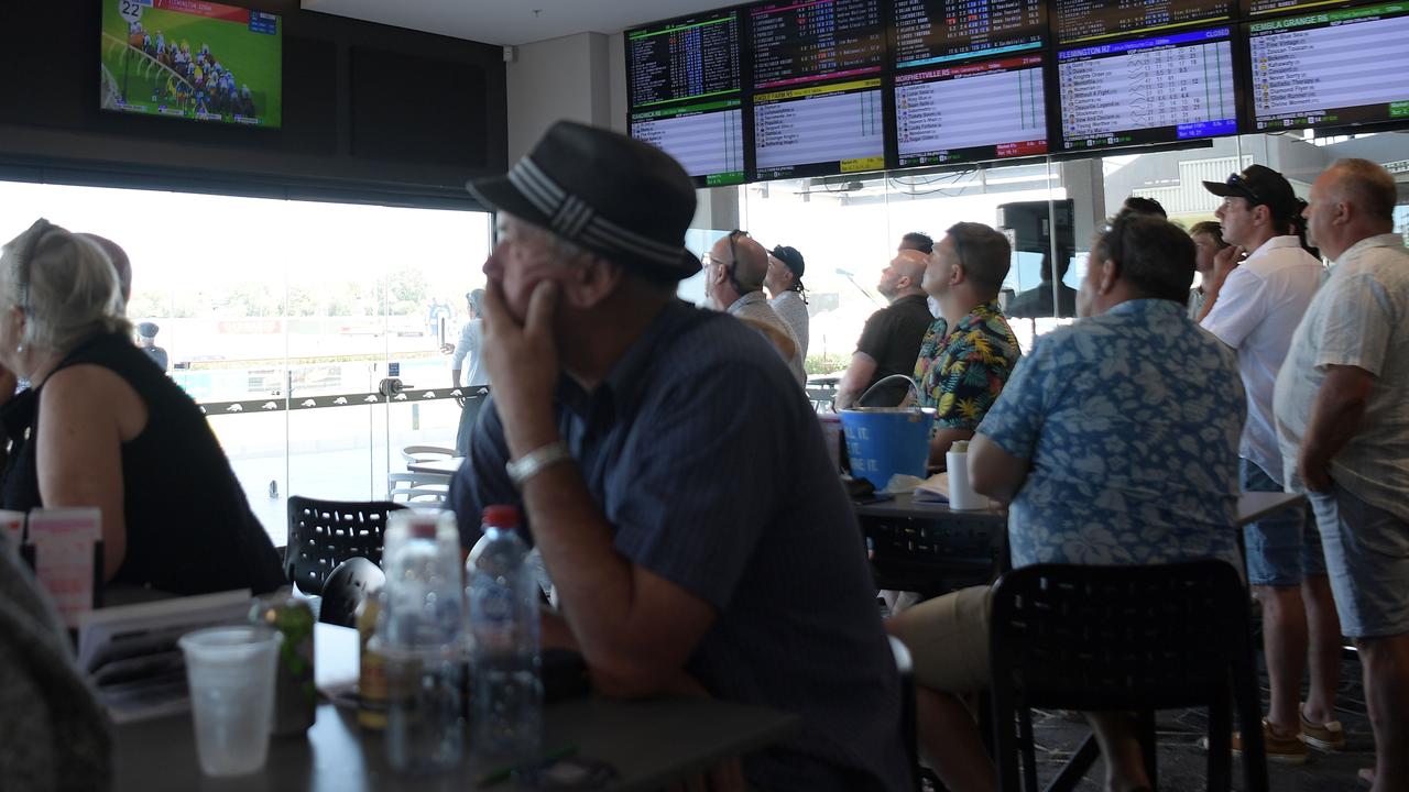 Punters at Darwin Turf Club watch the Melbourne Cup. Picture: (A)manda Parkinson