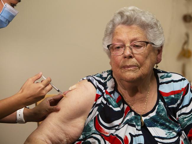 ADELAIDE, AUSTRALIA - Advertiser Photos FEBRUARY 23, 2021: Rembrandt Aged Care resident Margje Ketellapper 90yrs receives the Pfizer Vaccine for COVID-19 from Immunisation Nurse Lynn Phan in the age care facility at Oaklands Park, SA. Picture: Emma Brasier