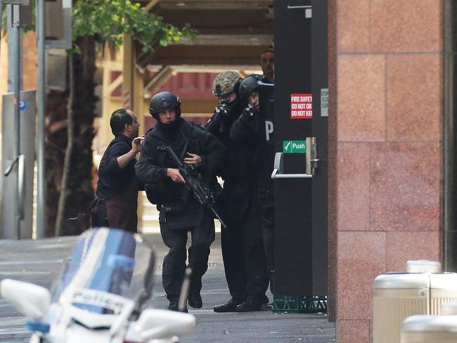 A hostage runs to safety outside the Lindt Cafe, Martin Place Picture: Mark Metcalfe/Getty Images