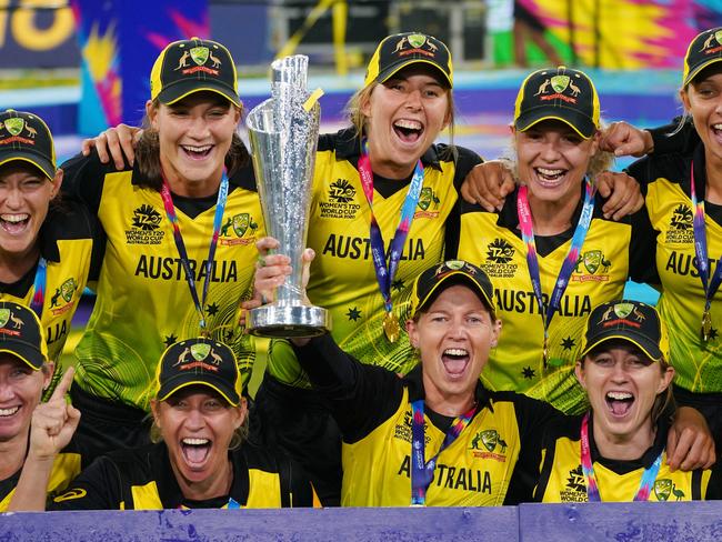 Meg Lanning of Australia and her teammates celebrate with the trophy after winning the Women's T20 World Cup final match between Australia and India at the MCG in Melbourne, Sunday, March 8, 2020. (AAP Image/Scott Barbour) NO ARCHIVING, EDITORIAL USE ONLY, IMAGES TO BE USED FOR NEWS REPORTING PURPOSES ONLY, NO COMMERCIAL USE WHATSOEVER, NO USE IN BOOKS WITHOUT PRIOR WRITTEN CONSENT FROM AAP