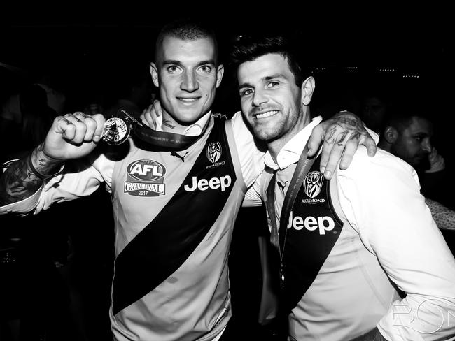 Dusty with his skipper Trent Cotchin. Picture: Bond Bar