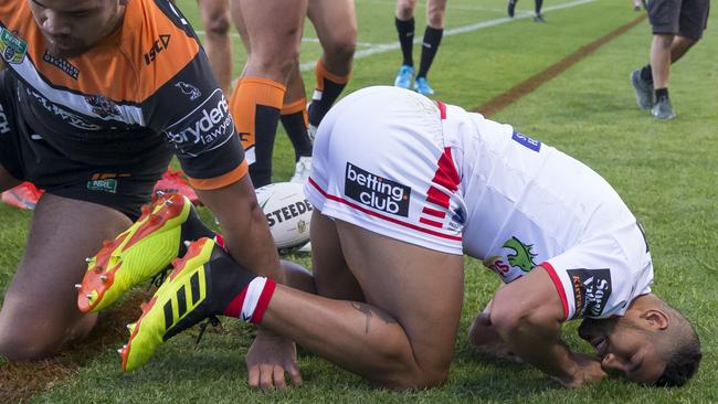 Nene MacDonald of the Dragons is tackled into touch and goes off injured during the Round 18 NRL match between the St George-Illawarra Dragons and the Wests Tigers. Picture: AAP Image